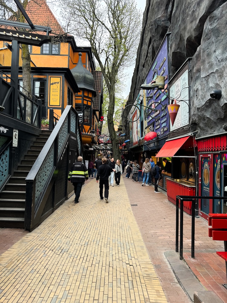 A walkway lined with games at Tivoli Gardens