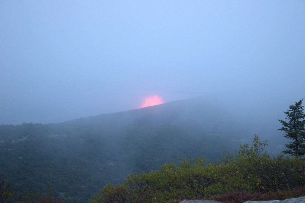Sunrise at Cadillac Mountain on a foggy and cloudy day