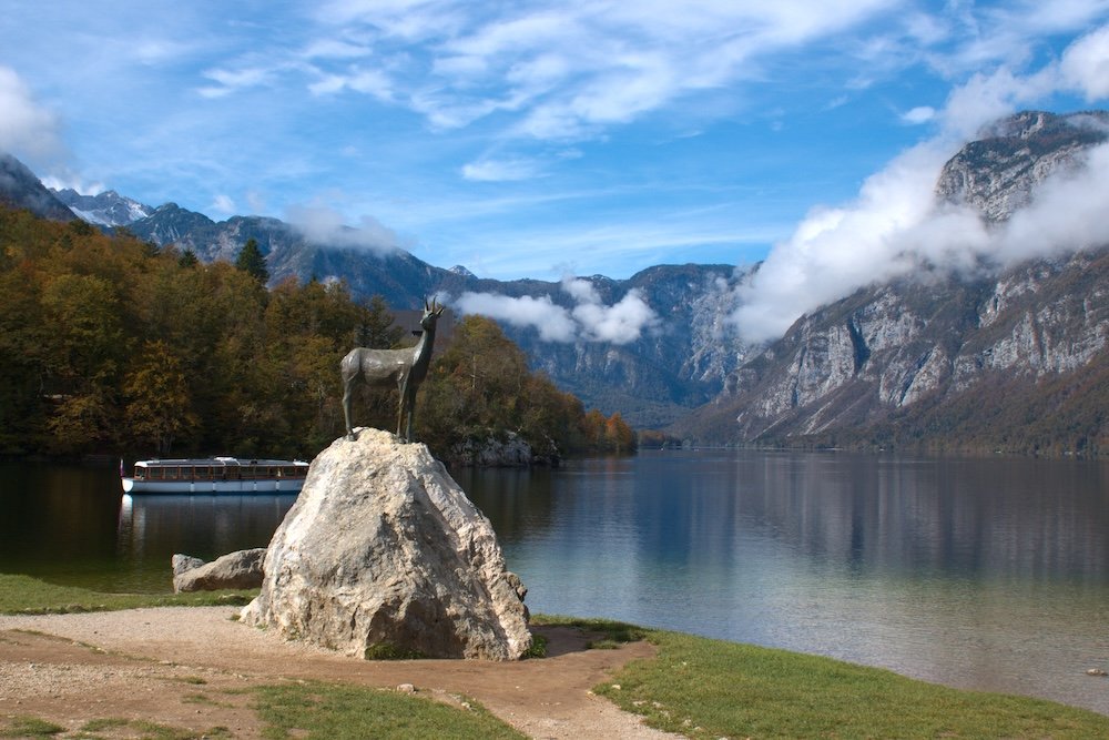Goat statue and Lake Bohinj