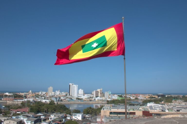 Cartagena flag and the Cartagena skyline as seen from Castillo San Felipe
