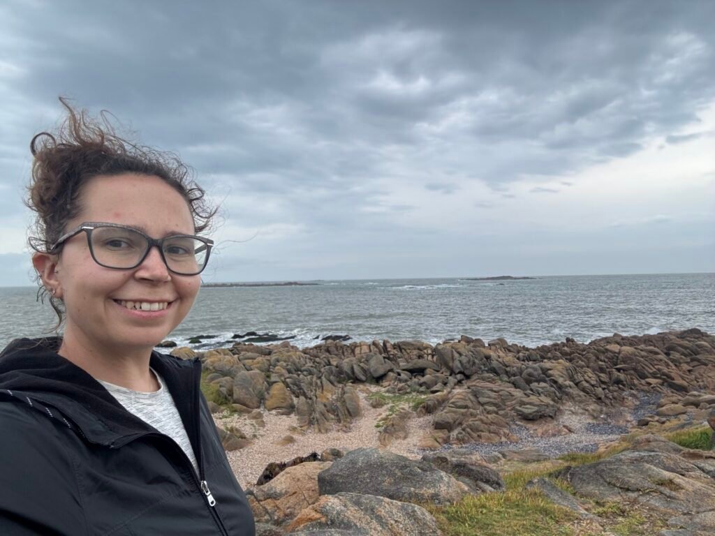 Author selfie in front of a beach in Cabo Polonio, Uruguay on a gray day