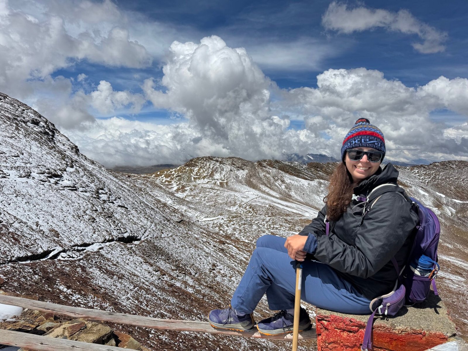 Photo of the author surrounded my snow covered mountains