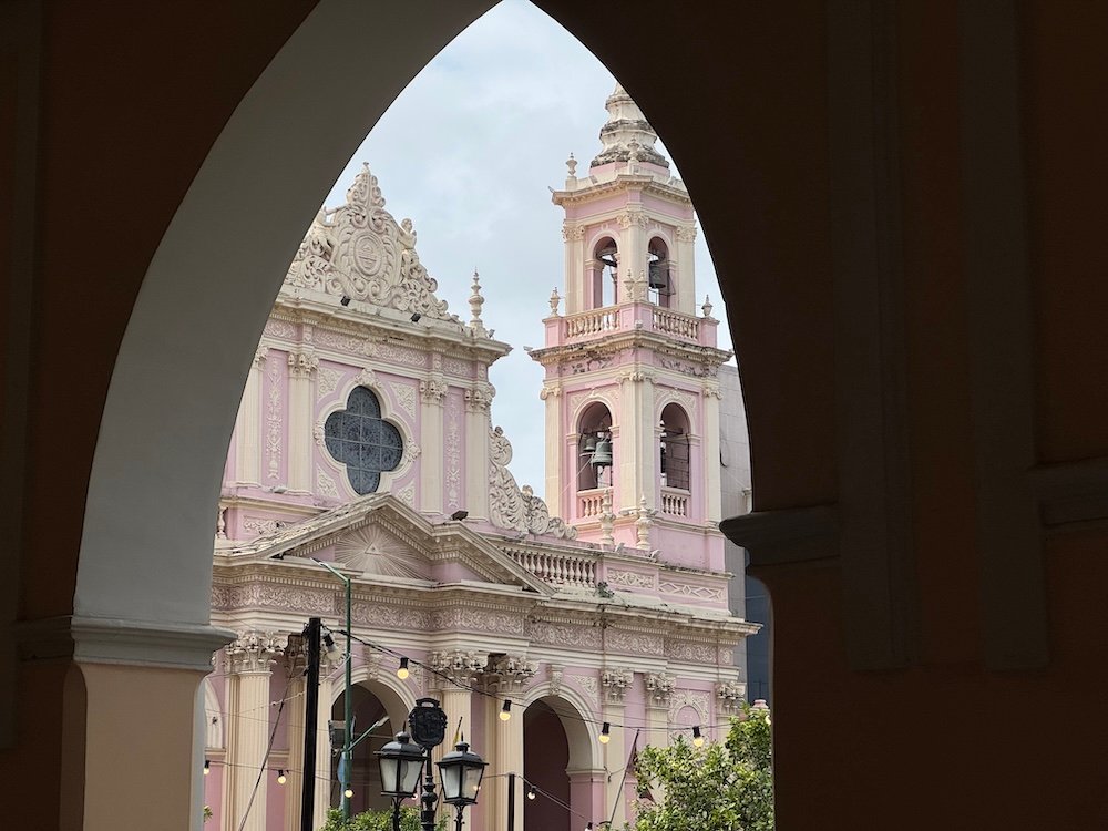 Peering through an archway at the cathedral in Salta