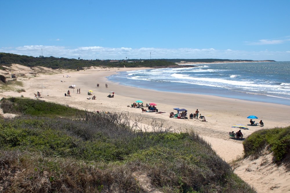 A view of a large beach and the ocean at Santa Teresa National Park