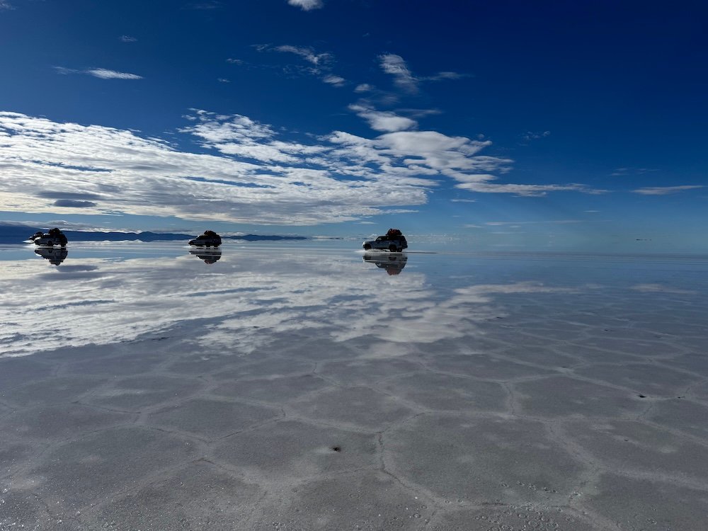 Jeeps driving across the Uyuni Salt Flats