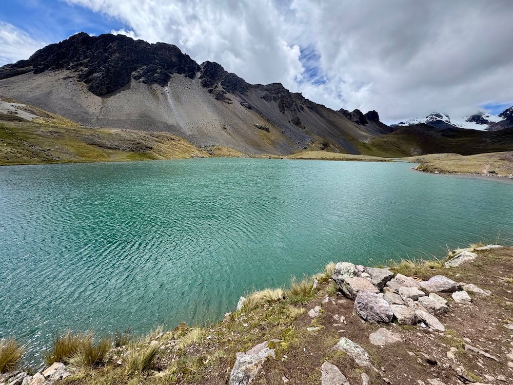 Blue lake with mountains in the background