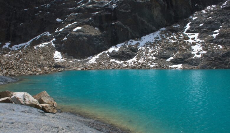Laguna Charquini surrounded by mountains