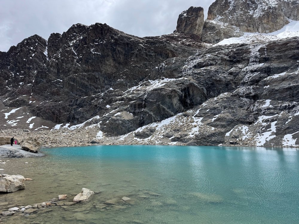 Laguna Charquini surrounded by mountains