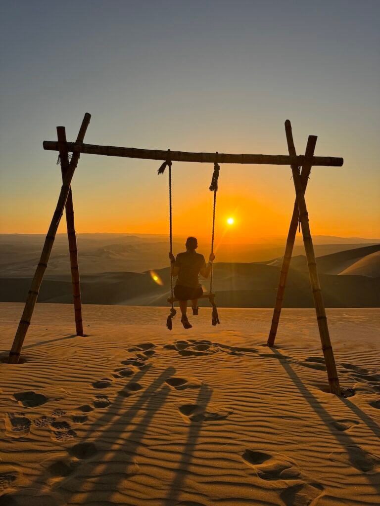Photo of the authro at sunset in Huacachina