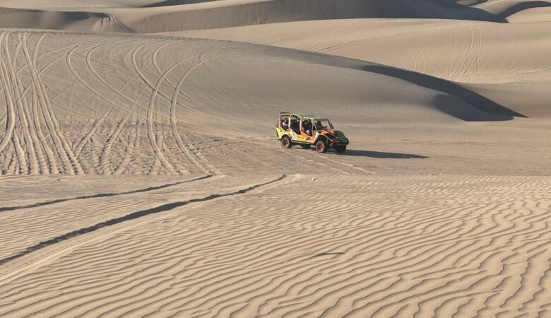 Dune buggy on a sand dune near Huacachina
