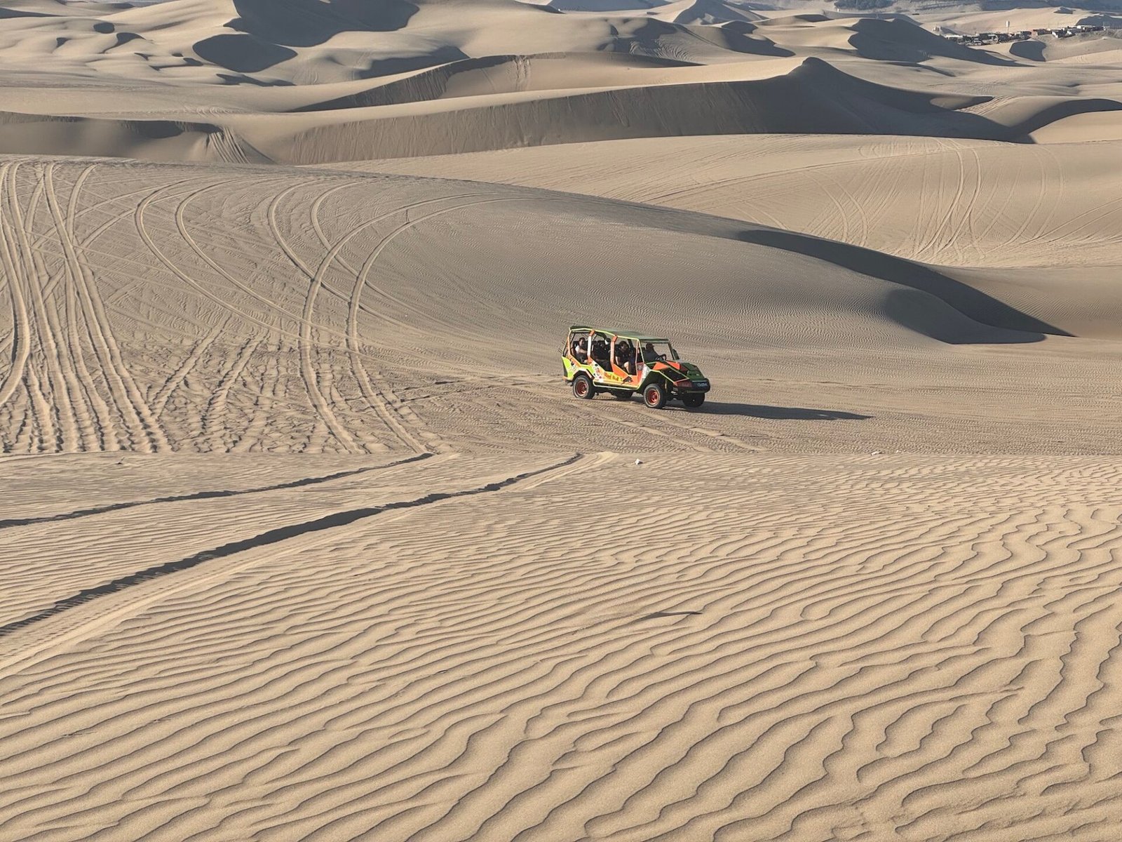 Dune buggy on a sand dune near Huacachina