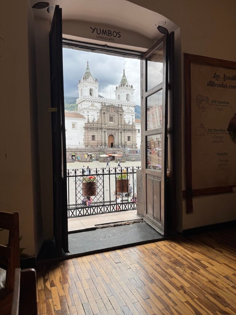 Looking out a window toward the San Francisco Church in Quito