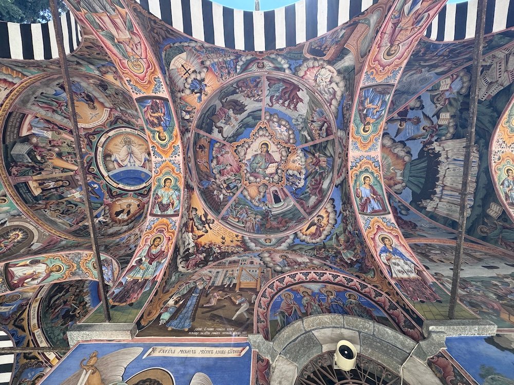 Looking up at frescoes at the Rila Monastery
